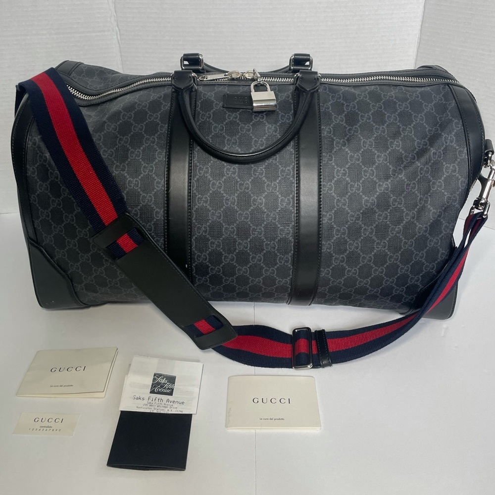 Authentic black Gucci Duffle Bag with removable strap